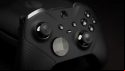 A Microsoft Elite Series 2 PC controller lies on the desk