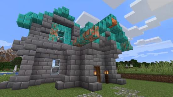Minecraft copper build: A building made of stone bricks, topped with a roof of copper blocks of varying degrees of oxidation.