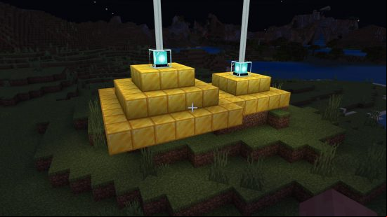 Minecraft beacon - two beacons glowing on top of gold blocks.