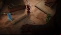 The adviser from Total War: Warhammer clears charts from a map of Grand Cathay in Total War: Warhammer 3, with three figurines representing approaching armies