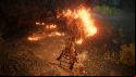 Breathing fire at a group of soldiers in a cave in Elden Ring