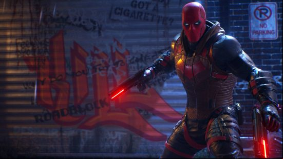 Gotham Knights styles: Red Hood is standing in an alleyway with graffiti on the wall. He is wearing a red mask and battle armour, while wielding two pistols.