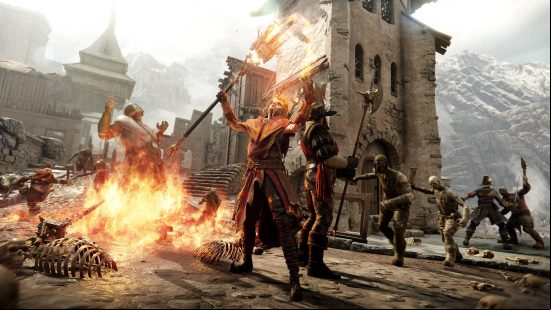 Best Warhammer games - a warrior and a mage stand together surrounded by enemies in Vermintide 2