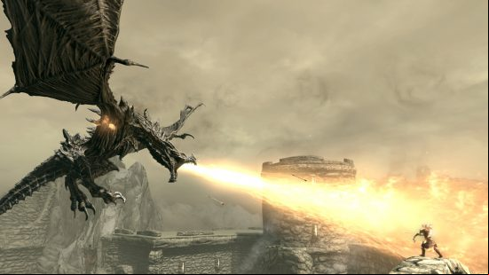 Best dragon games: Skyrim. Image shows a dragon breathing fire on somebody.