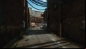 Escape from Tarkov screenshots: An alleyway with cracked pavement and graffiti animals painted on the side of a red brick building