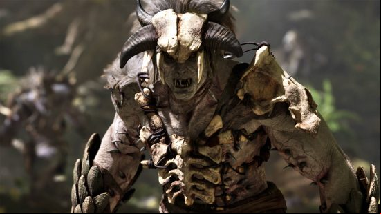 Ark 2 release date window: a humanoid monster with orc-like features wearing the skull of a horned creature. He is wearing bone armour.