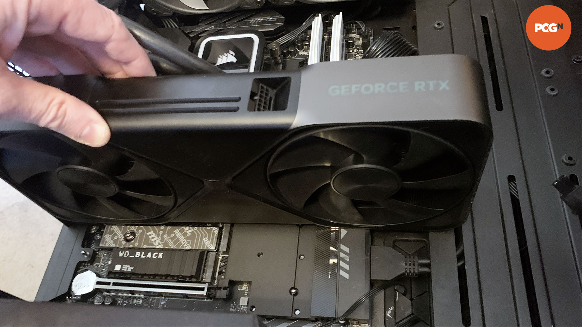 How to install a graphics card: Fit Nvidia GeForce RTX 5090 into graphics slot.