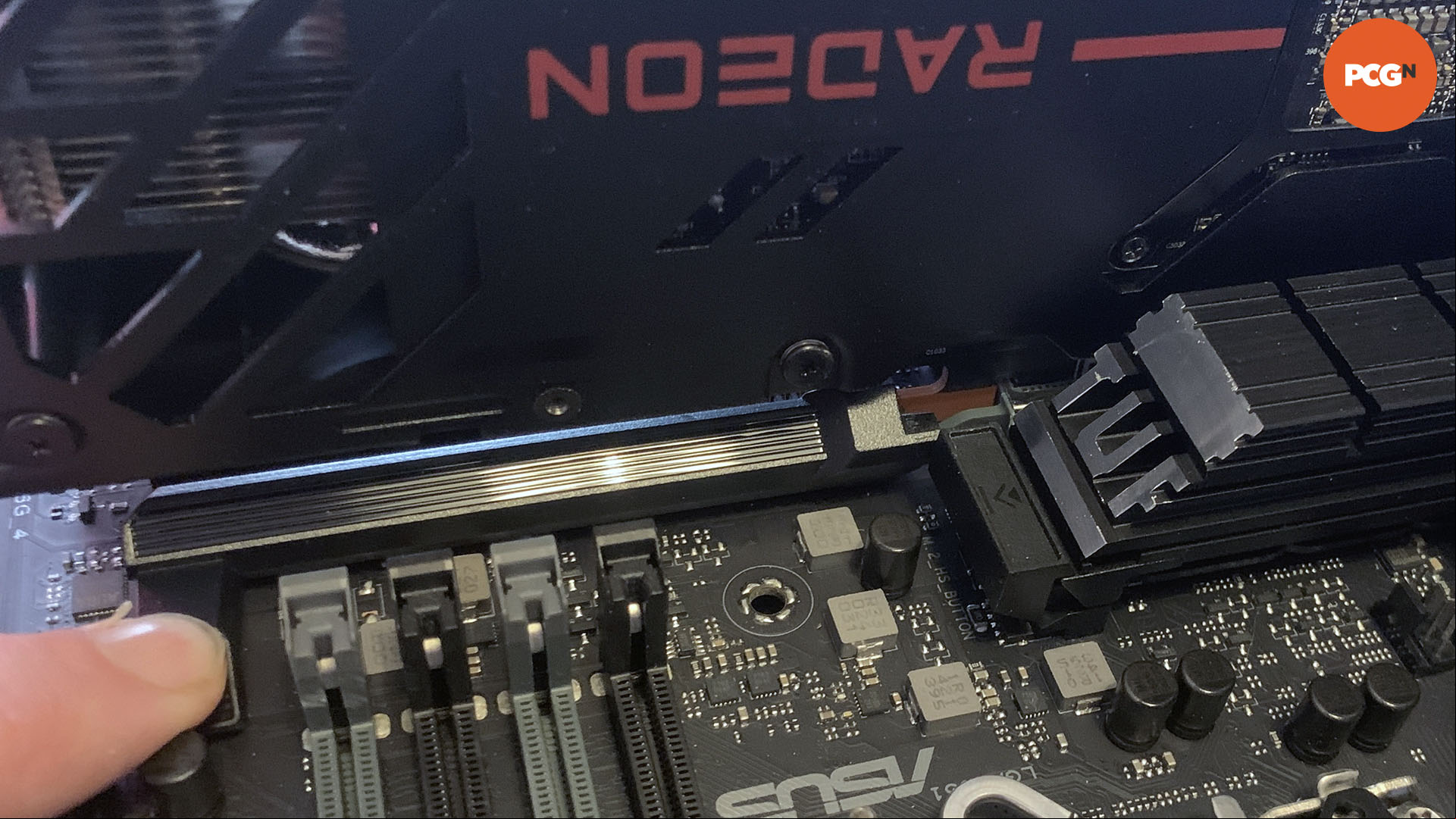 How to install a graphics card: Press PCIe slot latch on new motherboard.