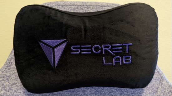 The Secretlab logo on its blakc magnetic memory foam head pillow