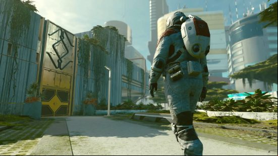 The player in an astronaut suit is approaching the headquarters of Starfield Constellation faction.