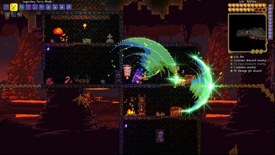 Terraria Steam success 2022 - a player fighting monsters in the Hellish Underworld with the Terra Blade, a sword that arcs green light