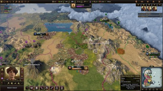 Games like Civilization: Defending a green and mountainous city in Old World, with the HUD shown over the top.