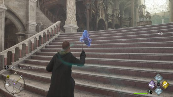Hogwarts Legacy empty paintings Lumos moths - a Hufflepuff wizard in a black robe with yellow lining is leading a moth up some stairs with his Lumos spell.