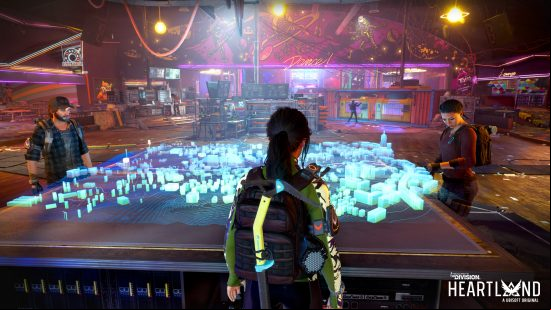 The Division Heartland - three people stand around a large war table with a 3D digital projection showing the map of Silver Creek on it