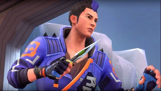 A japanese man with black hair with a blue streak wearing a blue combat jacket holding a knife on an icy location