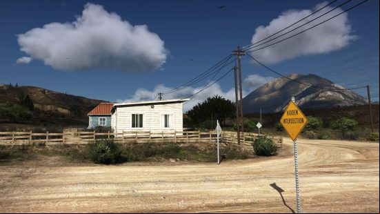 An intersection and a small house show off the realistic visuals of NaturalVision Remastered, one of the best GTA 5 mods.