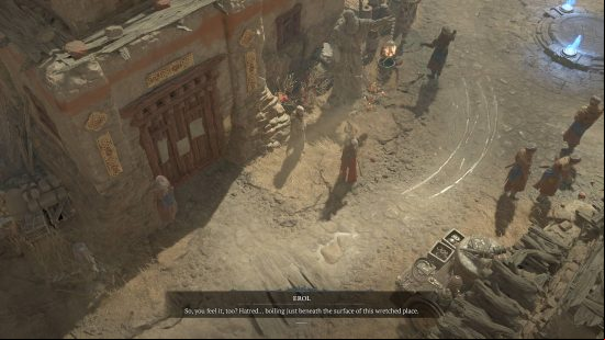 A woman in red and gold armor speaks to a man in a dusty desert town, he informs her that hatred is rife in this area