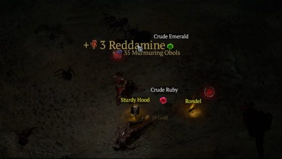 Reddamine, one of the many Diablo 4 resources, and other valuable items, lay on the floor having burst from a chest.