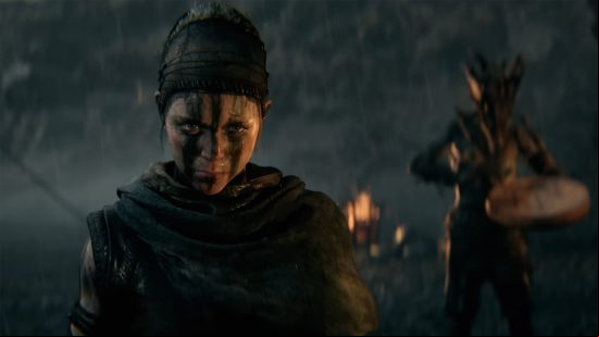 Senua's Saga: Hellblade 2 release date: Senua looks menacingly in front of her, whilst a fire burns in the background