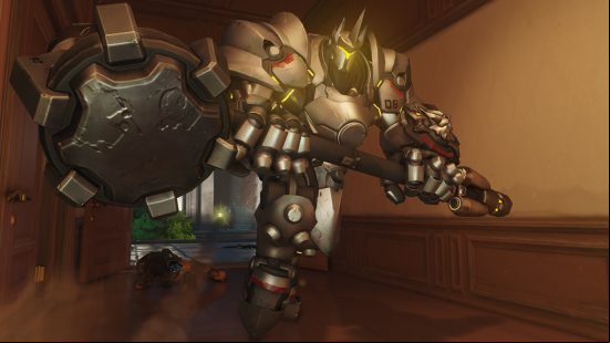Overwatch 2 characters: a very large man in silver armor wielding a huge hammer.