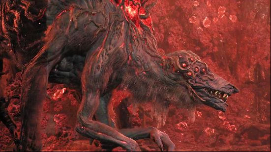 Remnant 2 world bosses: The Corrupted Ravager stalks forward, its mutated arms hanging down as it goes and its many eyes blinking.