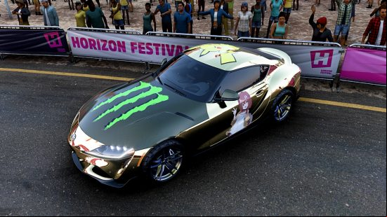 Forza Horizon 5 - A golden Toyota with various decals placed on the bodywork.