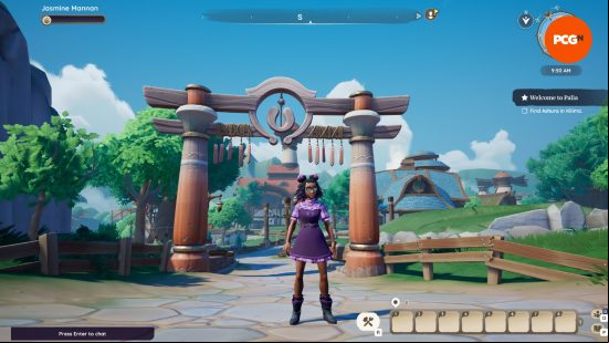 A woman with tanned skin and a purple dress wearing glasses stands under an archway made of wood in a summer setting