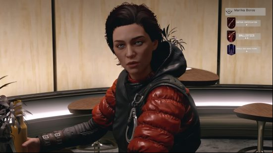 Starfield crew: a woman sits at a bar, she's wearing a red puffer jacket.