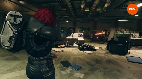 The player characters engages in a heated gunfight with a gang of Spacers in an office, the floor littered with fallen enemies and detritus as we engage in combat for our Starfield review.