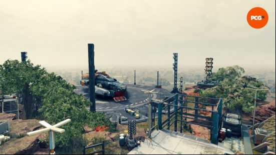 An industrial ship sits on an outpost's landing area, surrounded by lush vegetation and human infrastructure, just one of our pitstops as we traverse planets in our Starfield review.