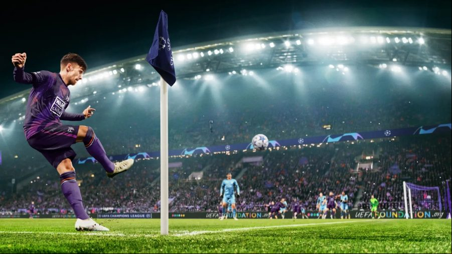 A footballer in a purple kit kicks a ball over bright green grass as a player from the other team awaits.