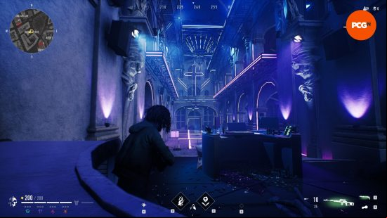 A character with dreadlocks wearing a green hoodie crouching in a blue and purple neon disco, a neon crucifix sign hands on the wall ahead of the DJ booth