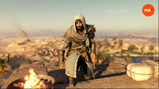 Basim is wearing the Rostam AC Mirage outfit while standing near a brazier. An oasis is in the desert behind him.