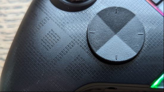 Asus ROG Raikiri Pro review: the d-pad of a black controller appears on-screen on a wooden desk.
