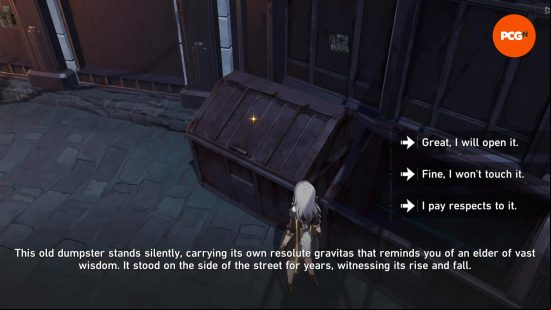 A silver haired girl wearing a black combat jacket with gold trims and shorts that match stands in front of a huge black dumpster