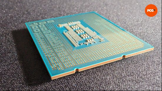 The backside of the Intel Core i9 14900K against a felt black background