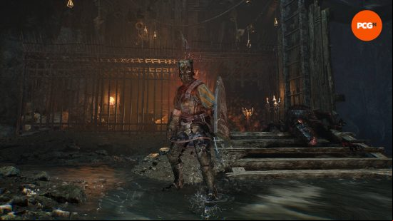 The lampbearer is standing in front of a makeshift jail in the mines, where the blacksmith used to reside. You can free her so you can upgrade the best Lords of the Fallen weapons.