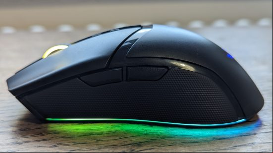 Razer Cobra Pro review: a black mouse with multicolored RGB appears on a wooden surface.