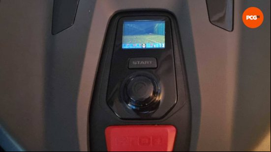An image of Doom playing on a tiny screen on a robotic lawn mower