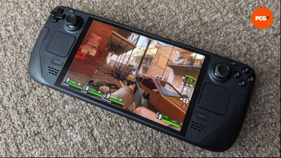 The Steam Deck OLED featuring a screenshot of Left 4 Dead 2 on its display