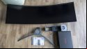 The The AOC Agon AG493UCX2 unassembled on a wooden floor