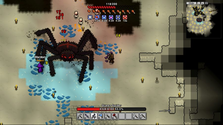 Necesse: A huge pixel spider in a cave surrounded by water as a player attempts to attack it