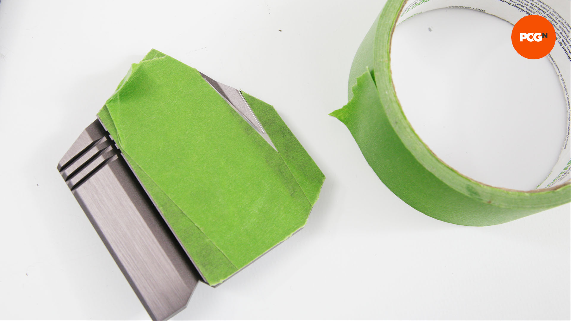 Heatsinks are covered with frog tape so they don't get paint on them during the motherboard painting process