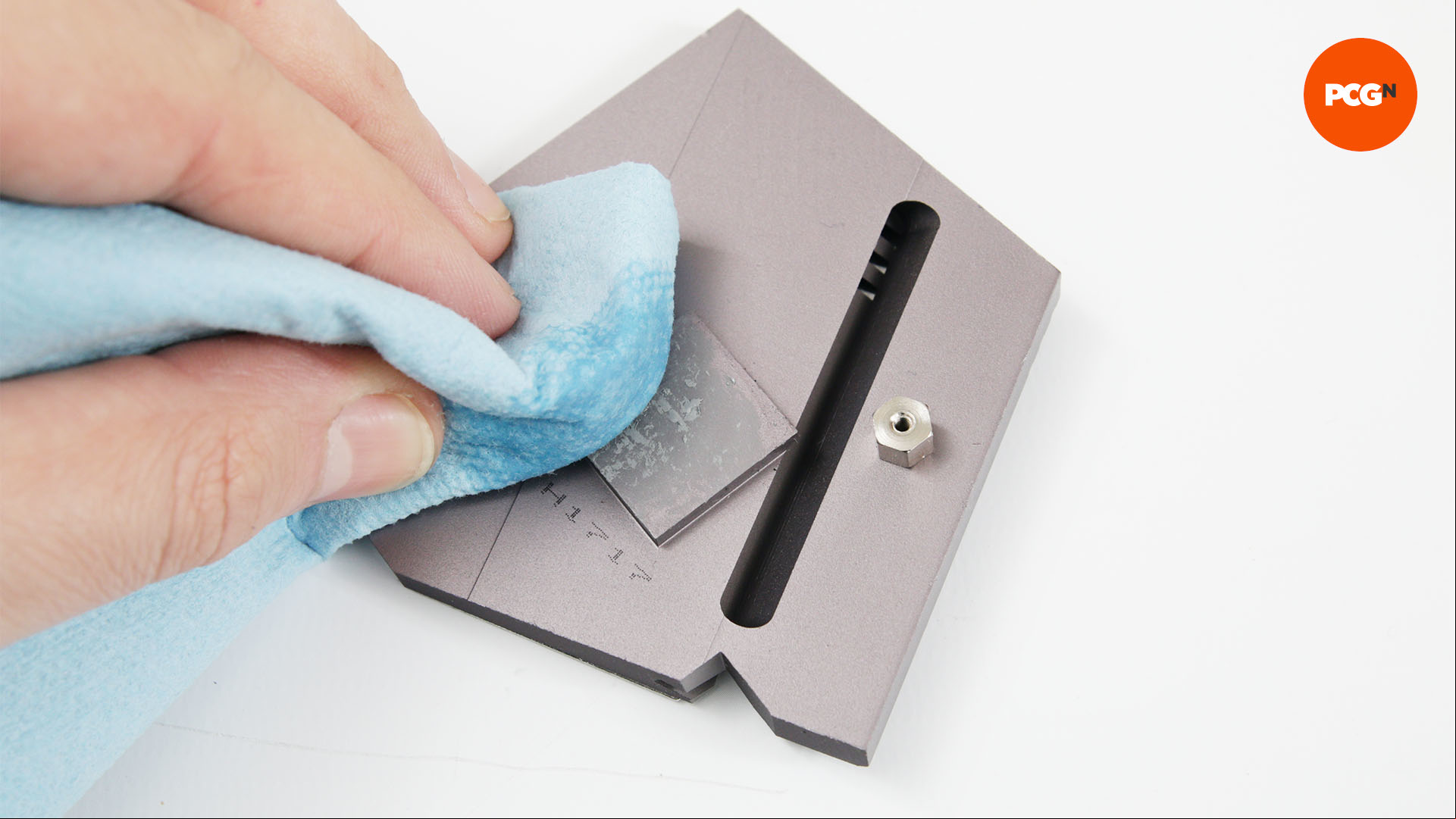 Dried thermal paste is removed from a motherboard part so it is ready for painting