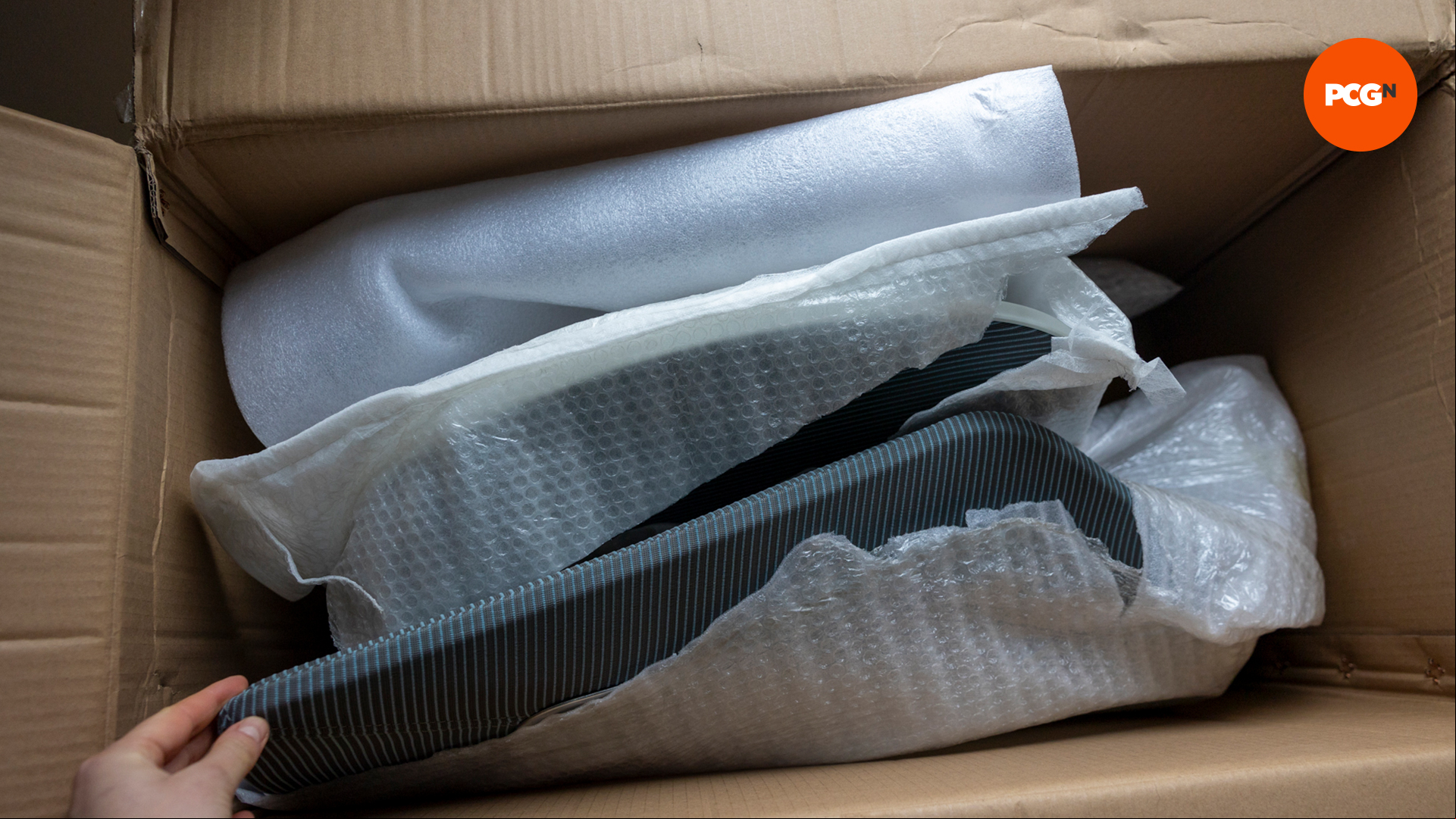 The FlexiSpot BS11 Pro chair parts wrapped in plastic