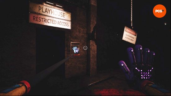 The player used their GrabPack to open a door in Poppy Playtime, one of the best puzzle games.