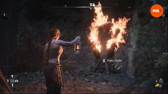 A player stands in front of a pirate bonfire where they can galvanize their crew in Skull and Bones.