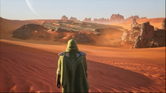 Dune Awakening: a cloaked figure stands in the middle of a huge desert.