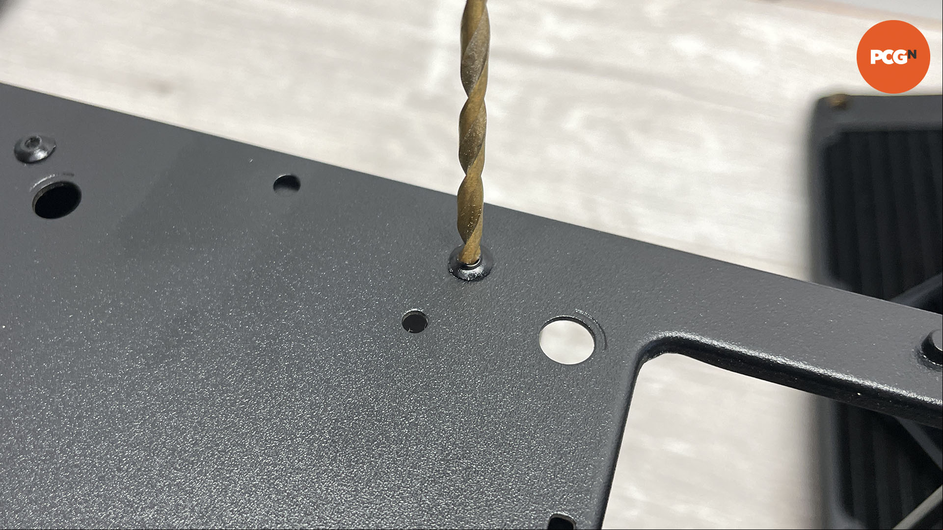 How to move the motherboard tray in your PC case: Drill out rivets