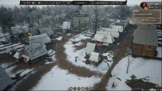 City building games: a birds eye view of a small medieval town, covered in snow.